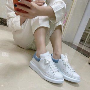 Alexander McQueen black tail cowhide white shoes